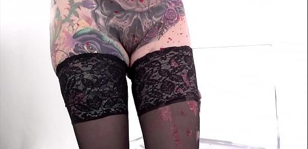  Tattooed babe Marie Bossette covers herself in hot wax